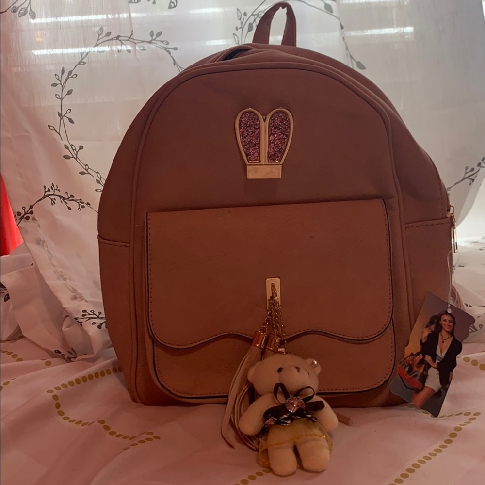 I’m selling a pinkish medium backpack